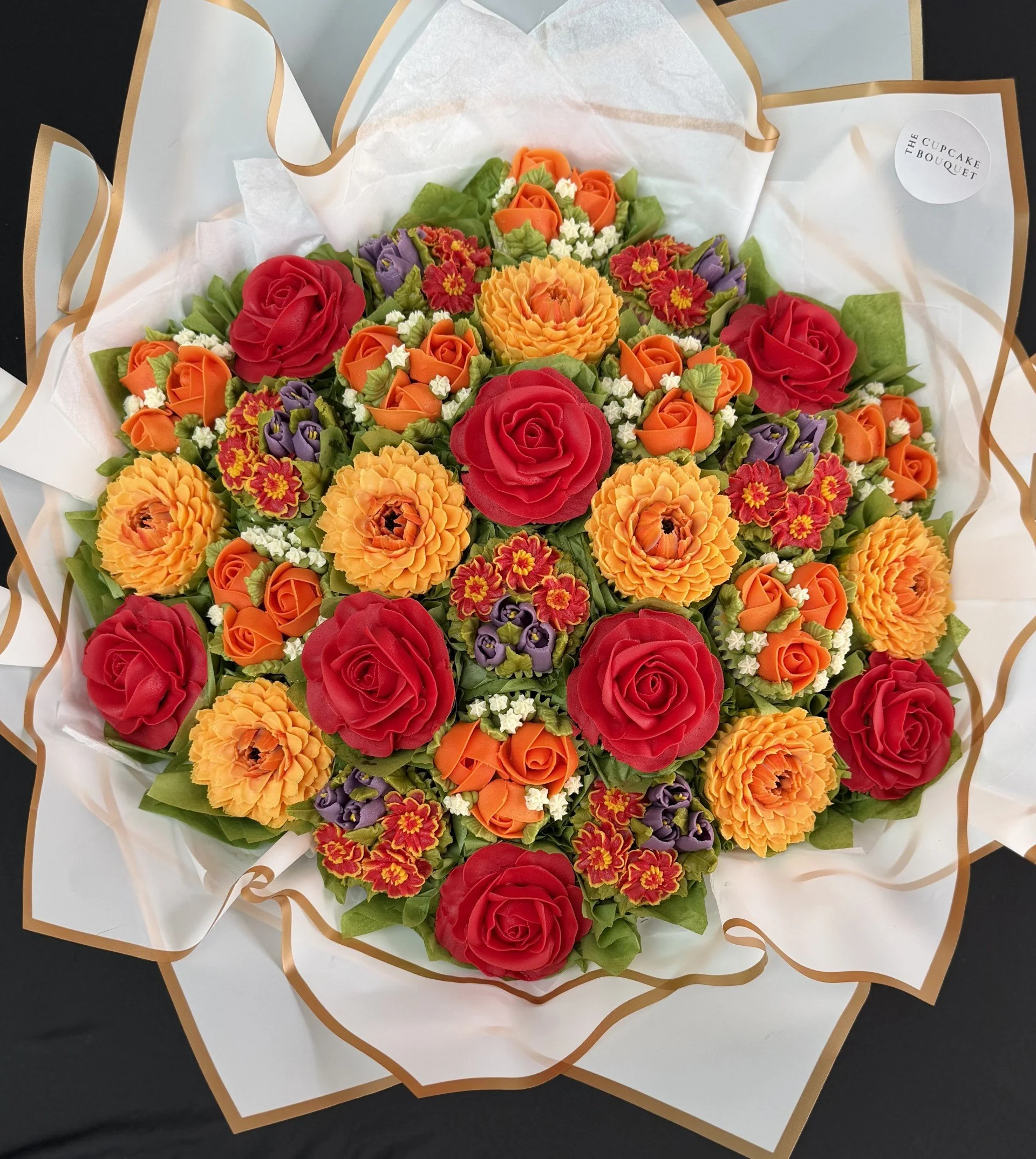 30 cupcake bouquet of 5 different blooms (40 x 40cm) 
Red, Orange and Purple Bouquet