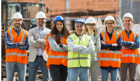 Photo of male an female construction workers in hard hats and high viz jackets