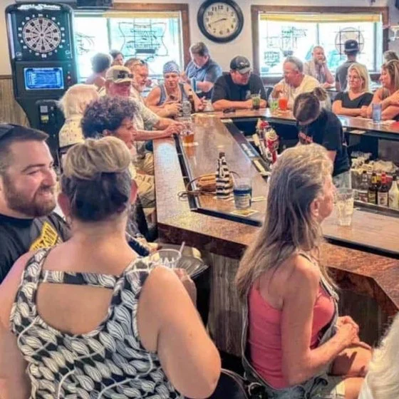 Guests gathered around the bar enjoying drinks and conversation at Centerhouse in Ripon, Wisconsin.