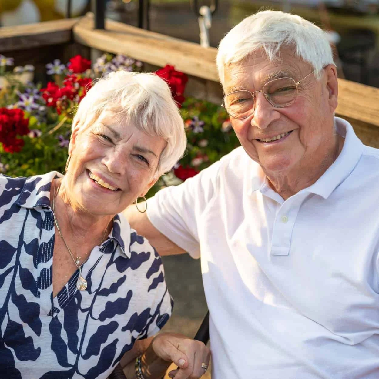 Smiling couple relaxing on the outdoor back deck at Centerhouse in Ripon, Wisconsin.