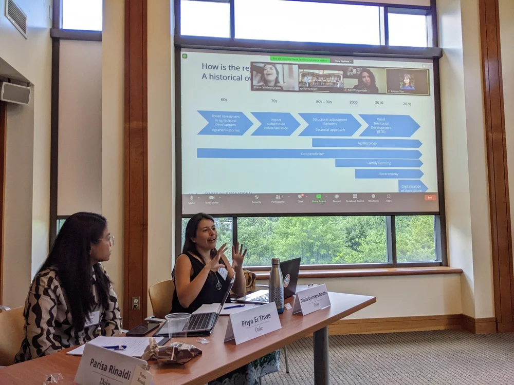 Research interns presenting a regional analysis at the workshop