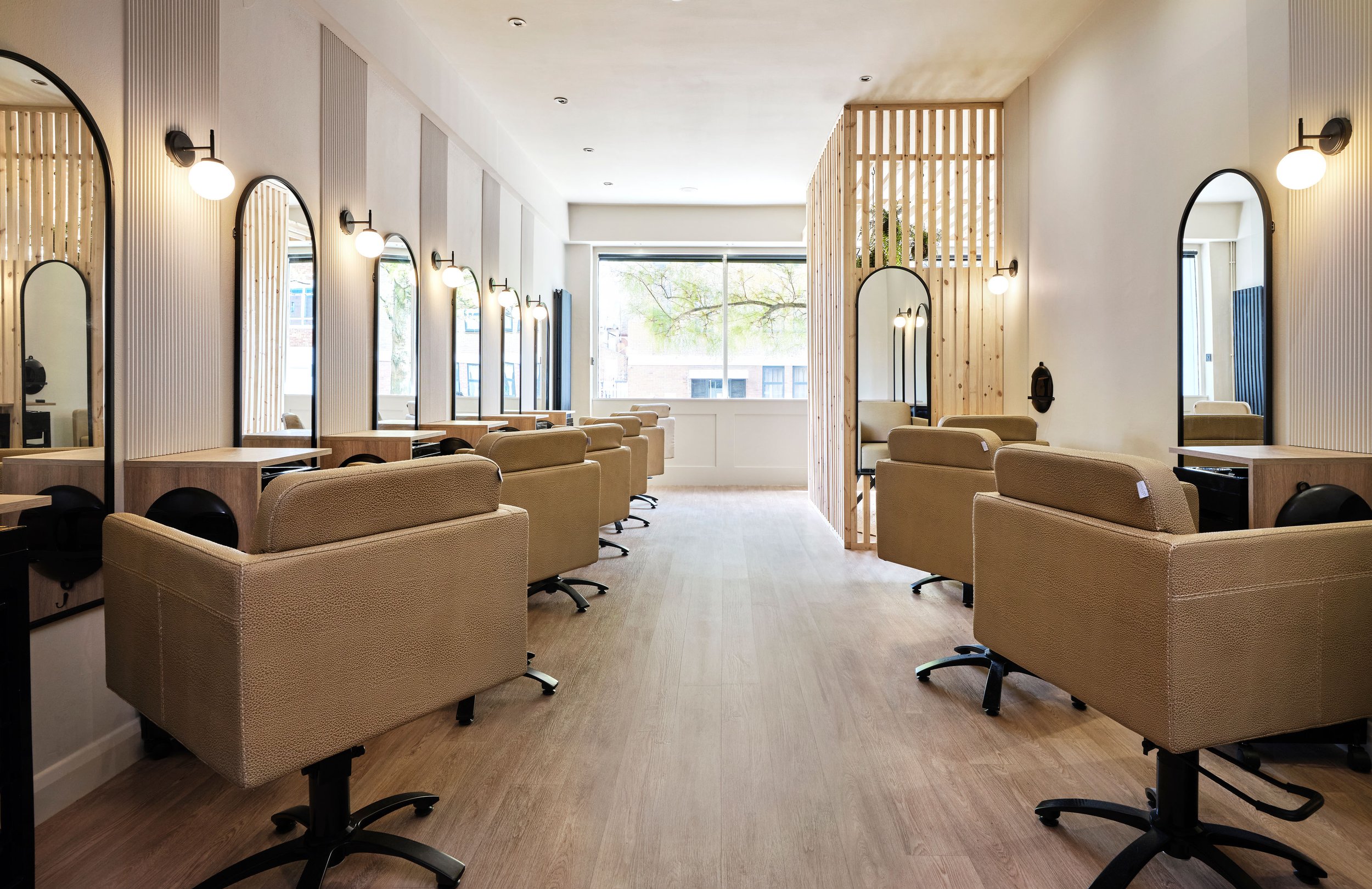 Panelled detail add interested to the colour drenched walls and ceiling in this spa-like hair styling sanctuary in Bedfordshire