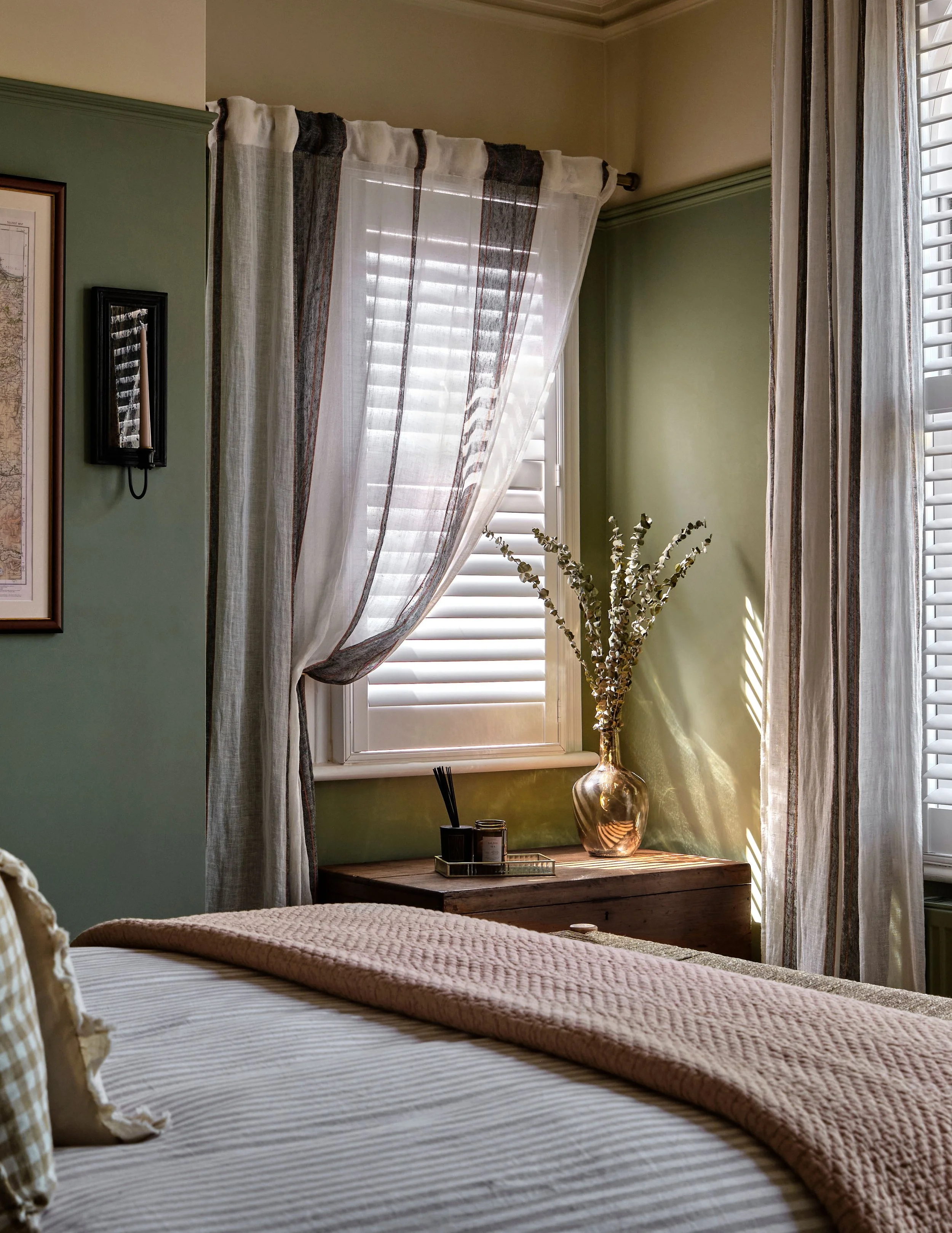 A soft, sheer draped curtain with a subtle stripe highlights the beauty of this individual window whilst contuning the narrative of the rest of the design