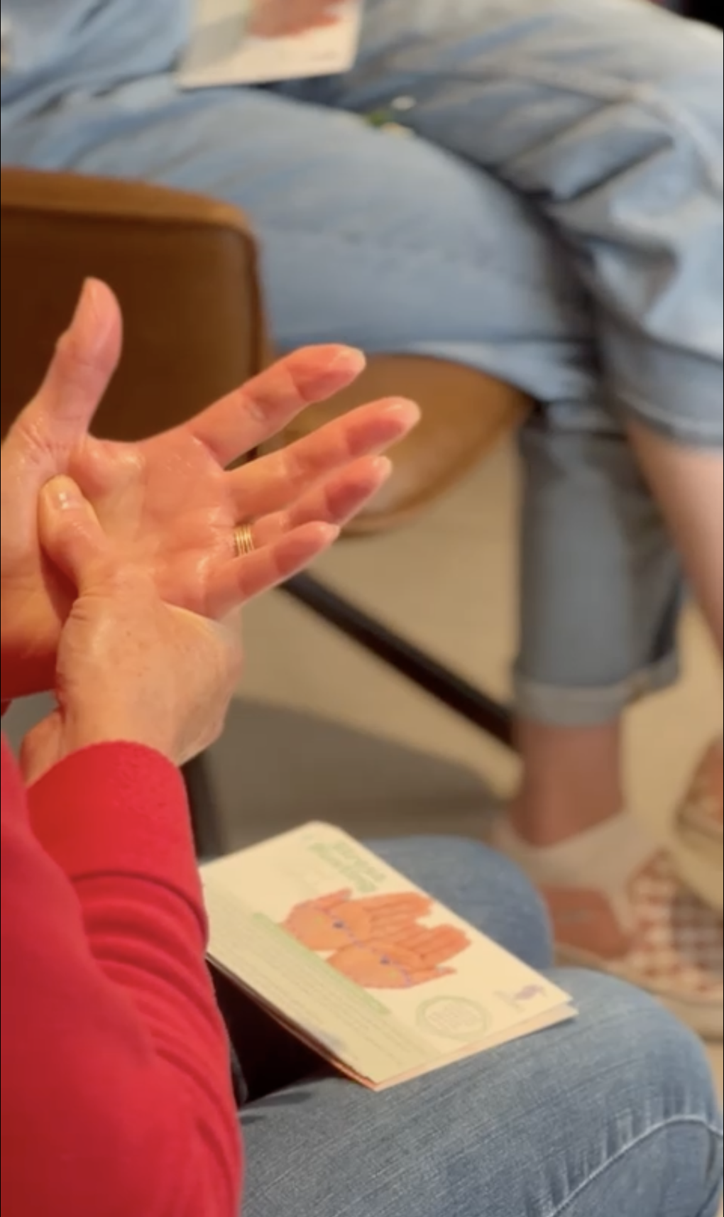 Hand reflexology workshop attendee practising techniques taught in workshop