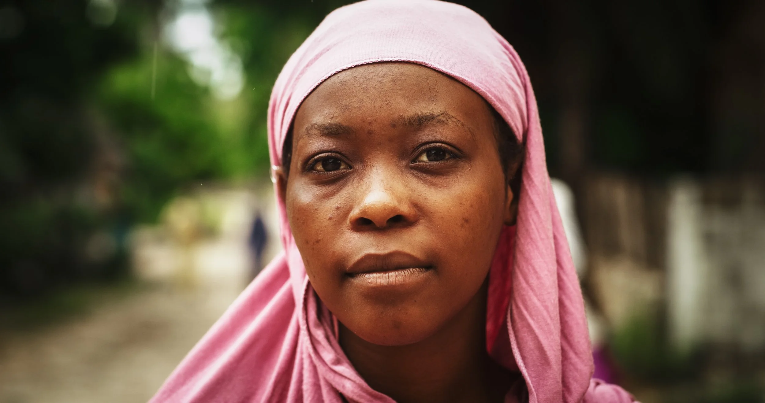 Young black woman looking straight to camera