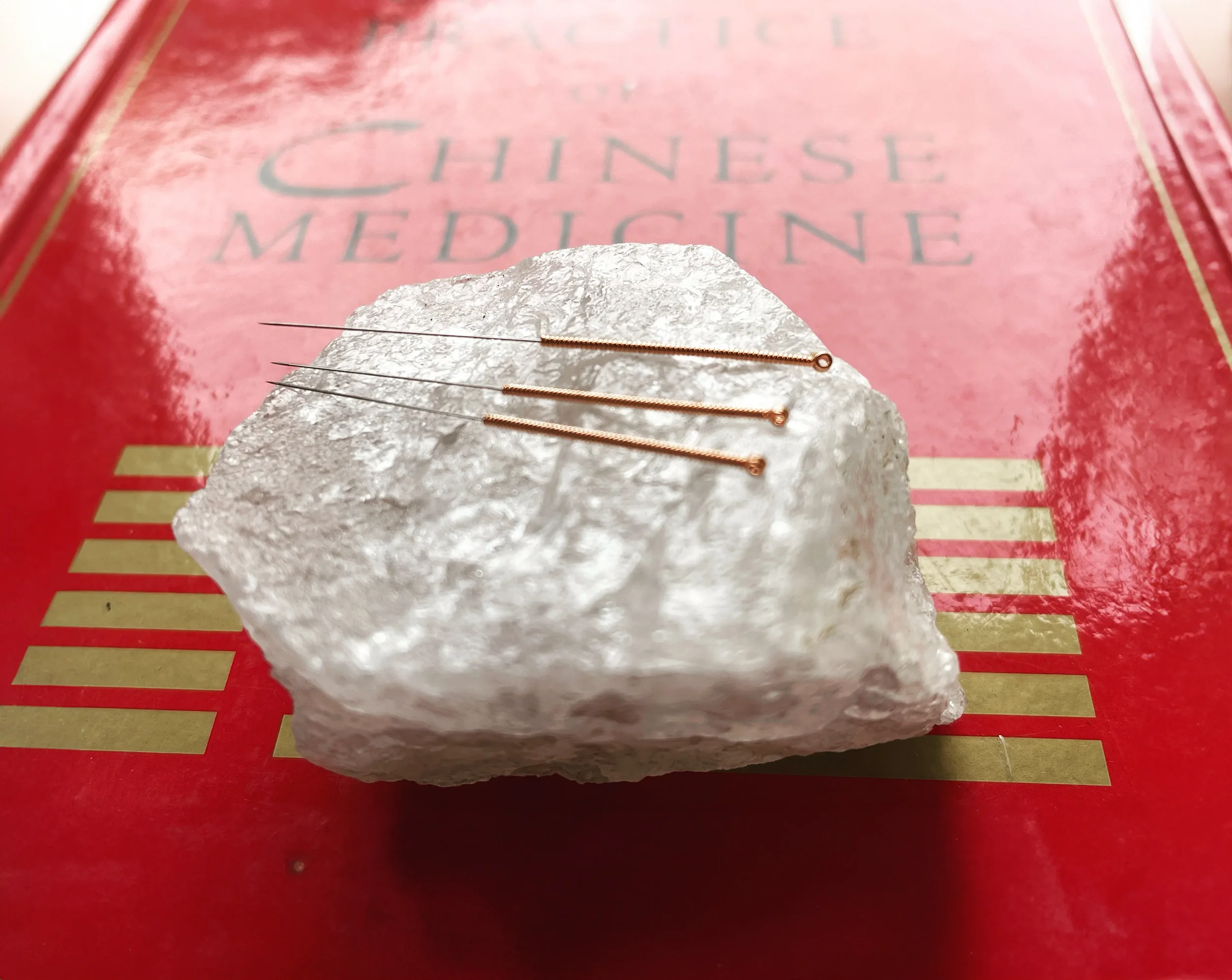 Chinese Five Element Acupuncture needles on crystal