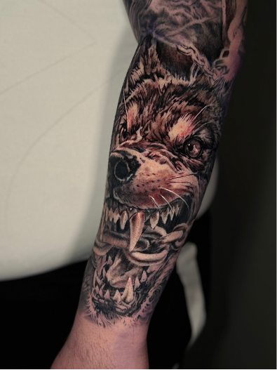 Img_ Hyper-realistic black and grey portrait sleeve tattoo.png
