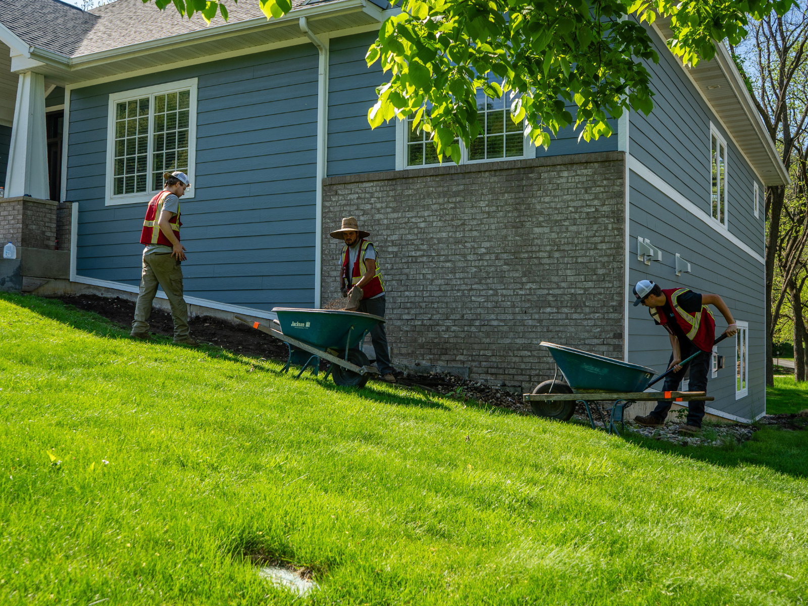  Landscape installation in progress with newly formed planting beds 