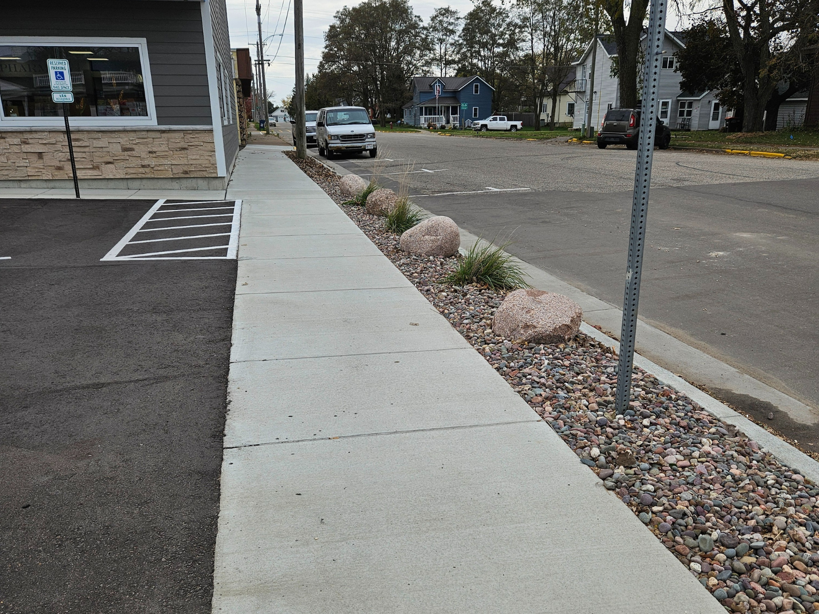 New concrete sidewalk with clean edges and landscaping
