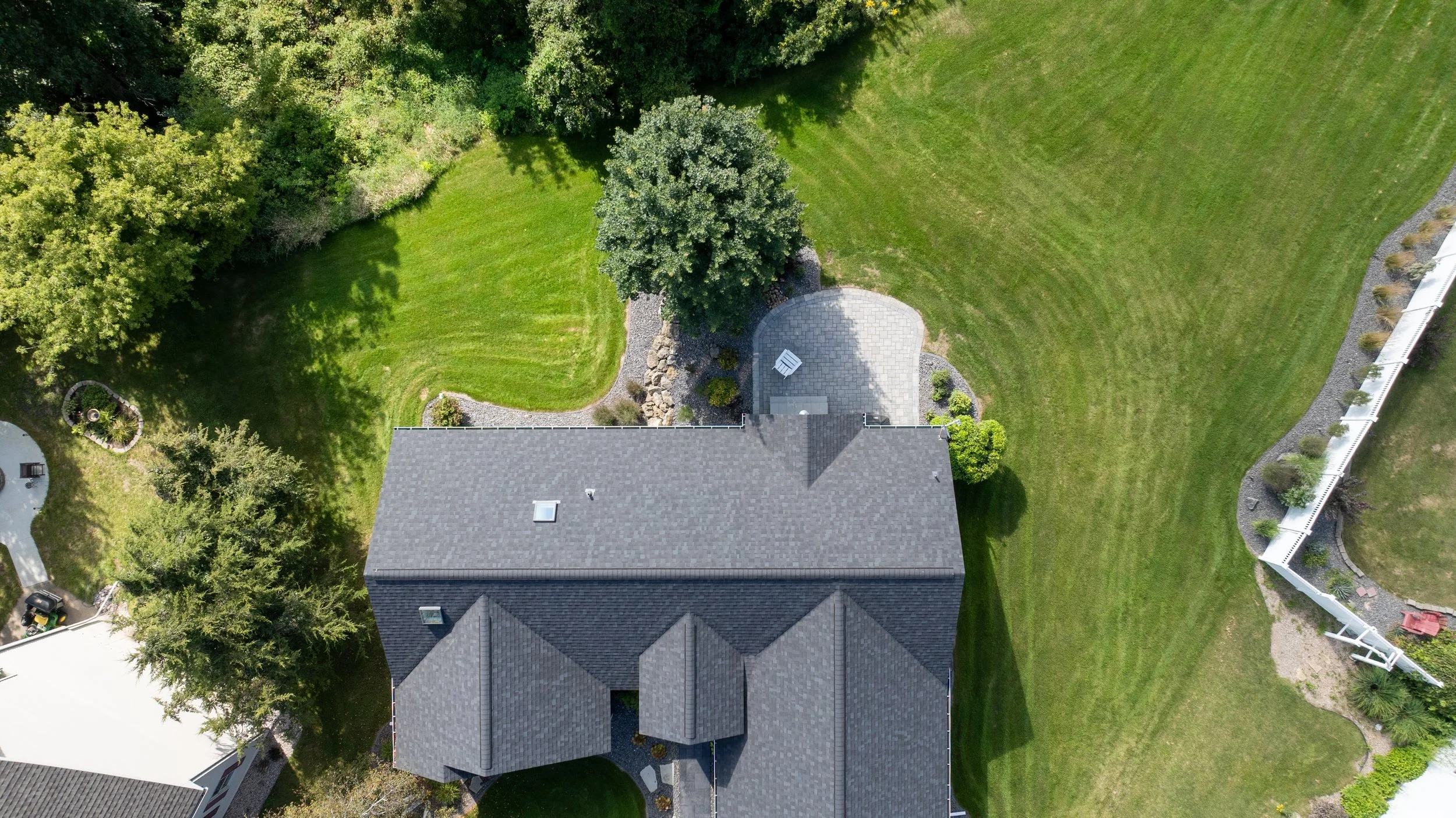 Overhead aerial view of the home and completed patio area.