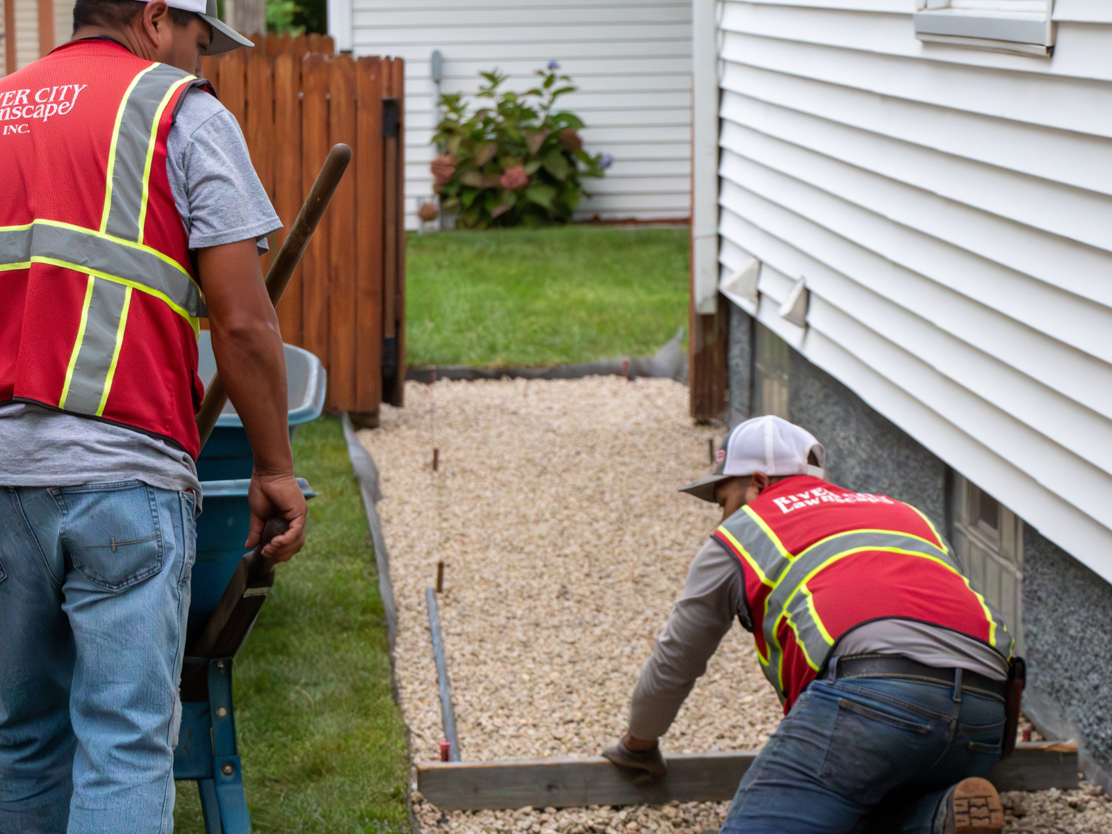 RCL employees working on stone walkway