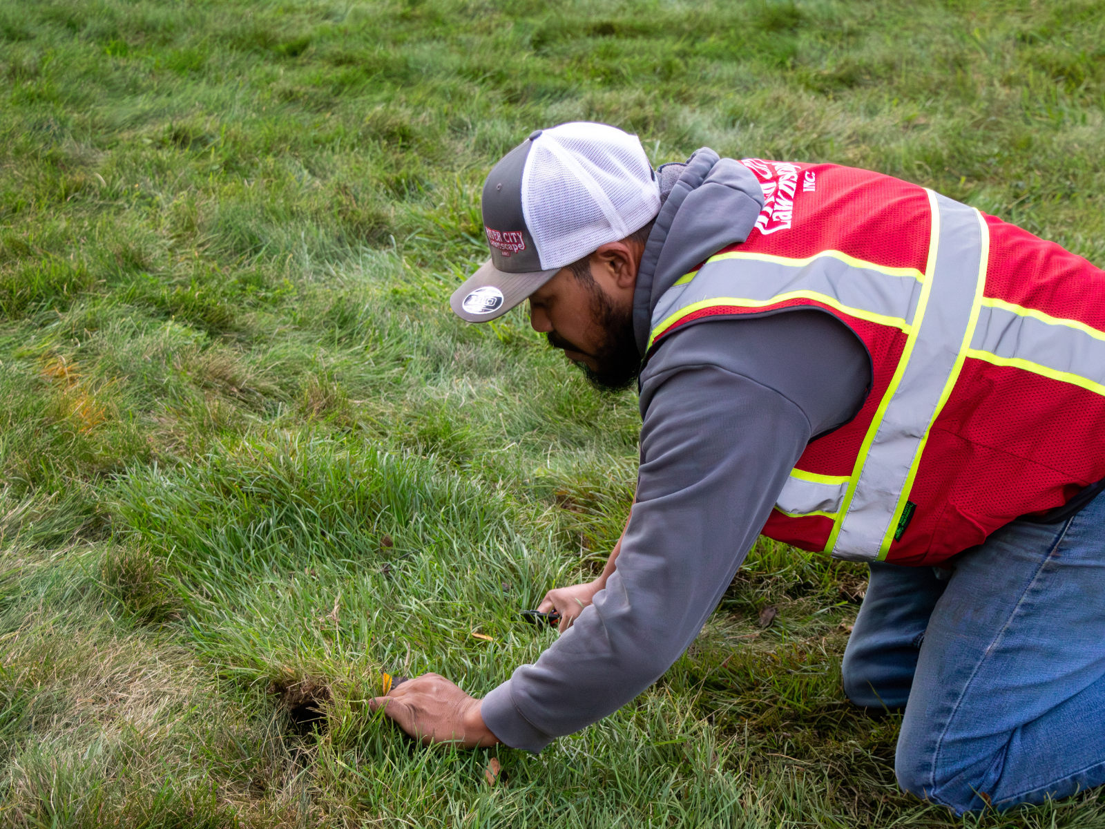 RCL employee examining ground
