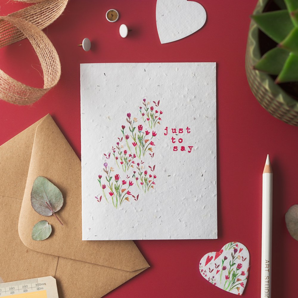  Christmas themed greeting card with red background and props 