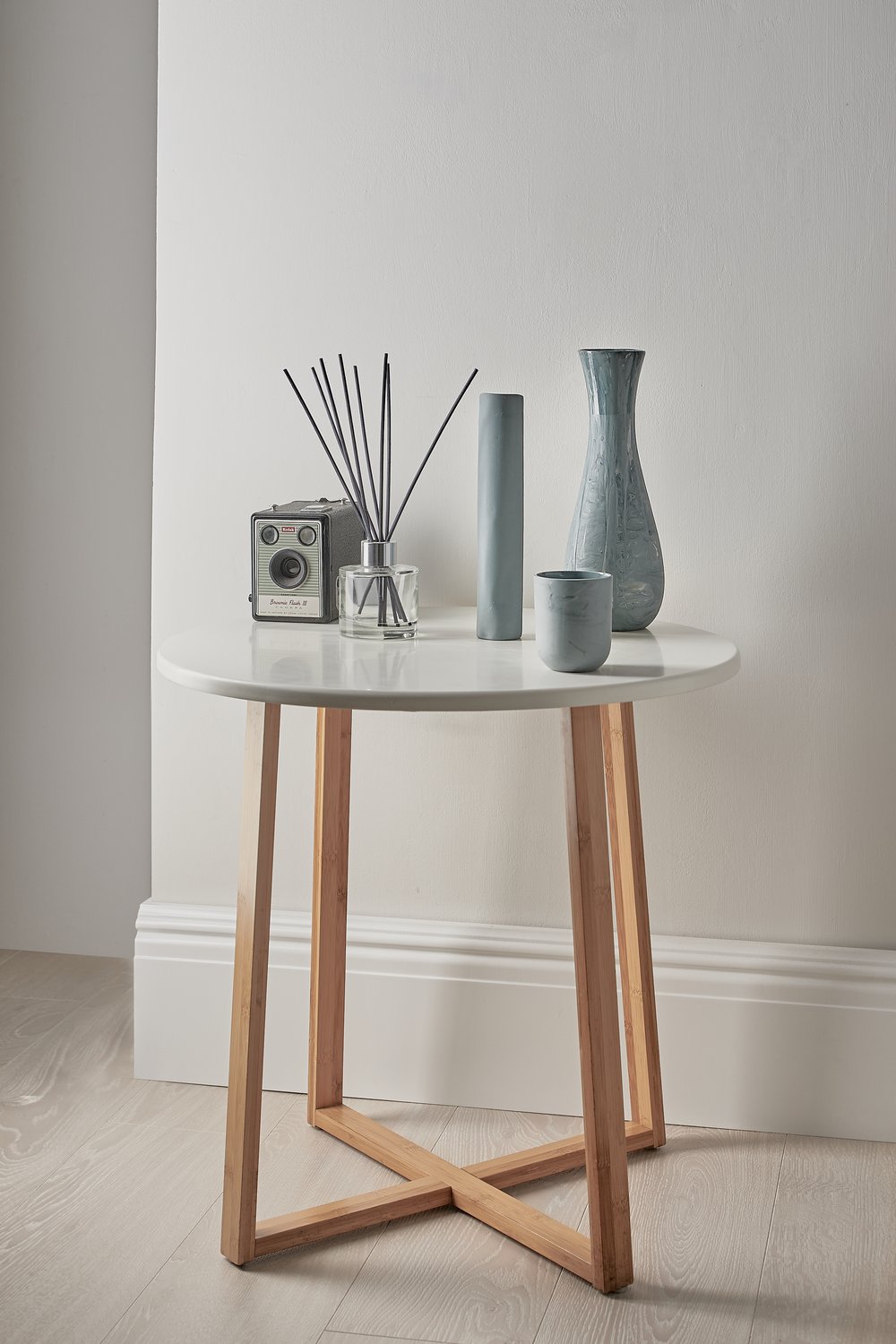  Contemporary ceramic design photographed in-situ within product photographer’s studio on habitat circular side table 