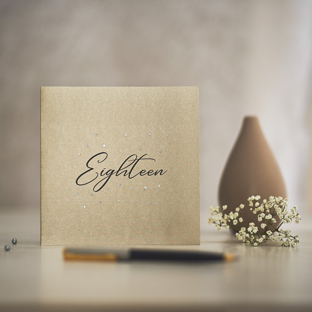  Elegant gold greeting cards warmly styled and photographed with small reflective jewels as props 