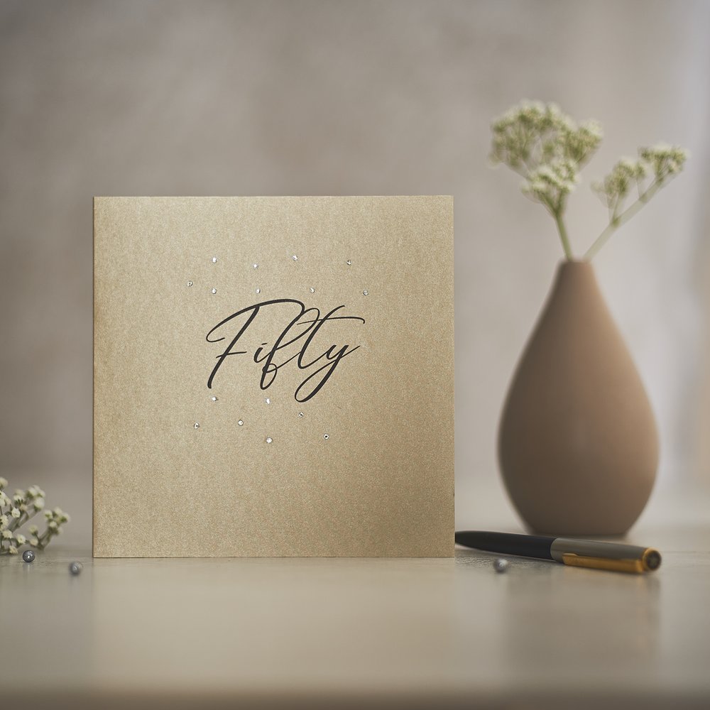  Elegant gold greeting cards warmly styled and photographed with small reflective jewels as props, design 3 