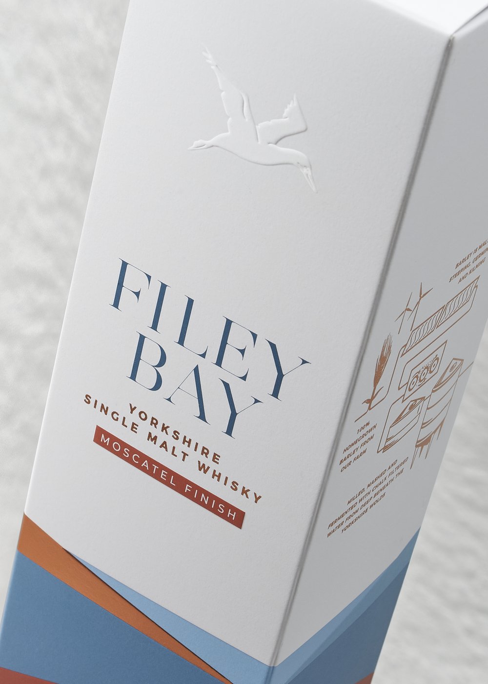  Filey Bay whisky bottle packaging carton photographed on an angle close-up 