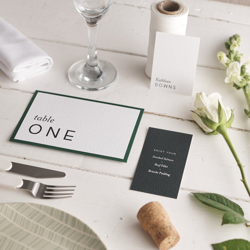  Table placement card part of wedding stationery suite with fresh flowers, cutlery and plate 