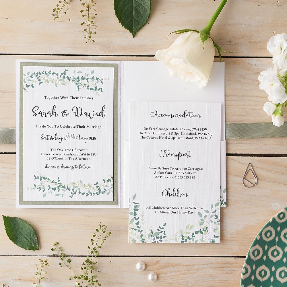  Wedding stationery invitations and detail card photographed on pale wooden background with props 3 