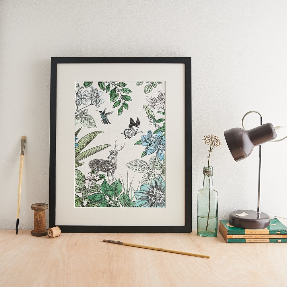  Nature inspired illustrative print in black frame photographed with vintage props 