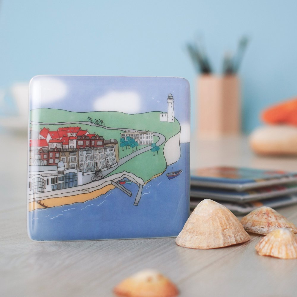  Coastal themed glass coaster photographed in appropriate setting with seashells 