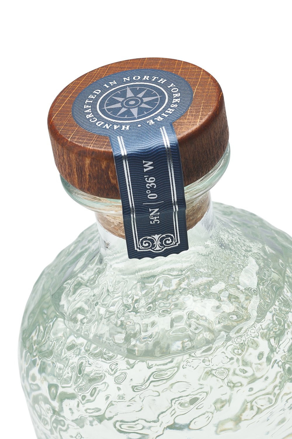  Close-up of Gin bottle focussing upon neck label and cork 