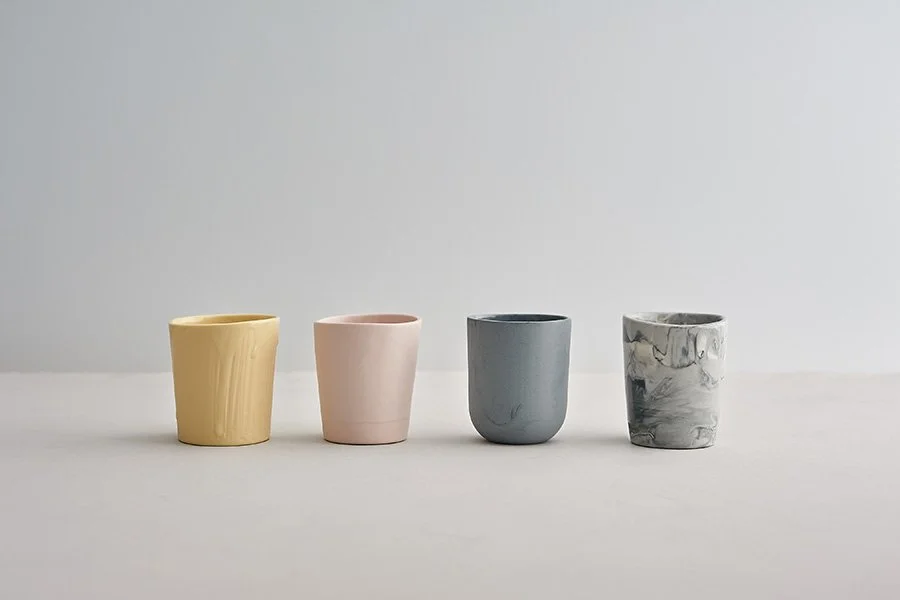 Handmade ceramic beakers in a row