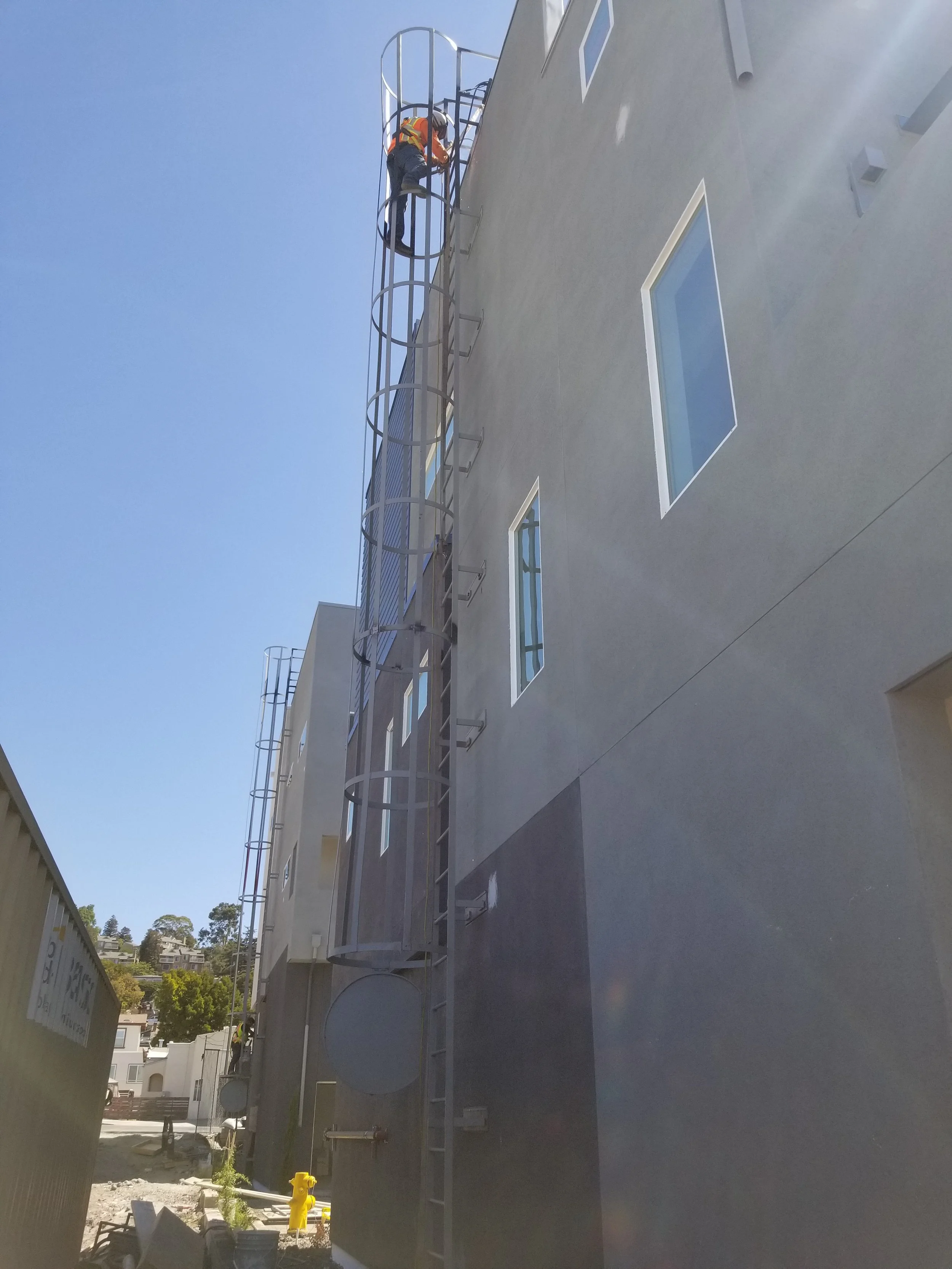 They are gray buildings with rectangular windows.