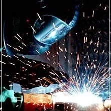 Precision in action as our iron projects professional works at the forefront of a leading custom iron works contractor. Adorned in gloves, mask, and uniform, witness the commitment to safety.