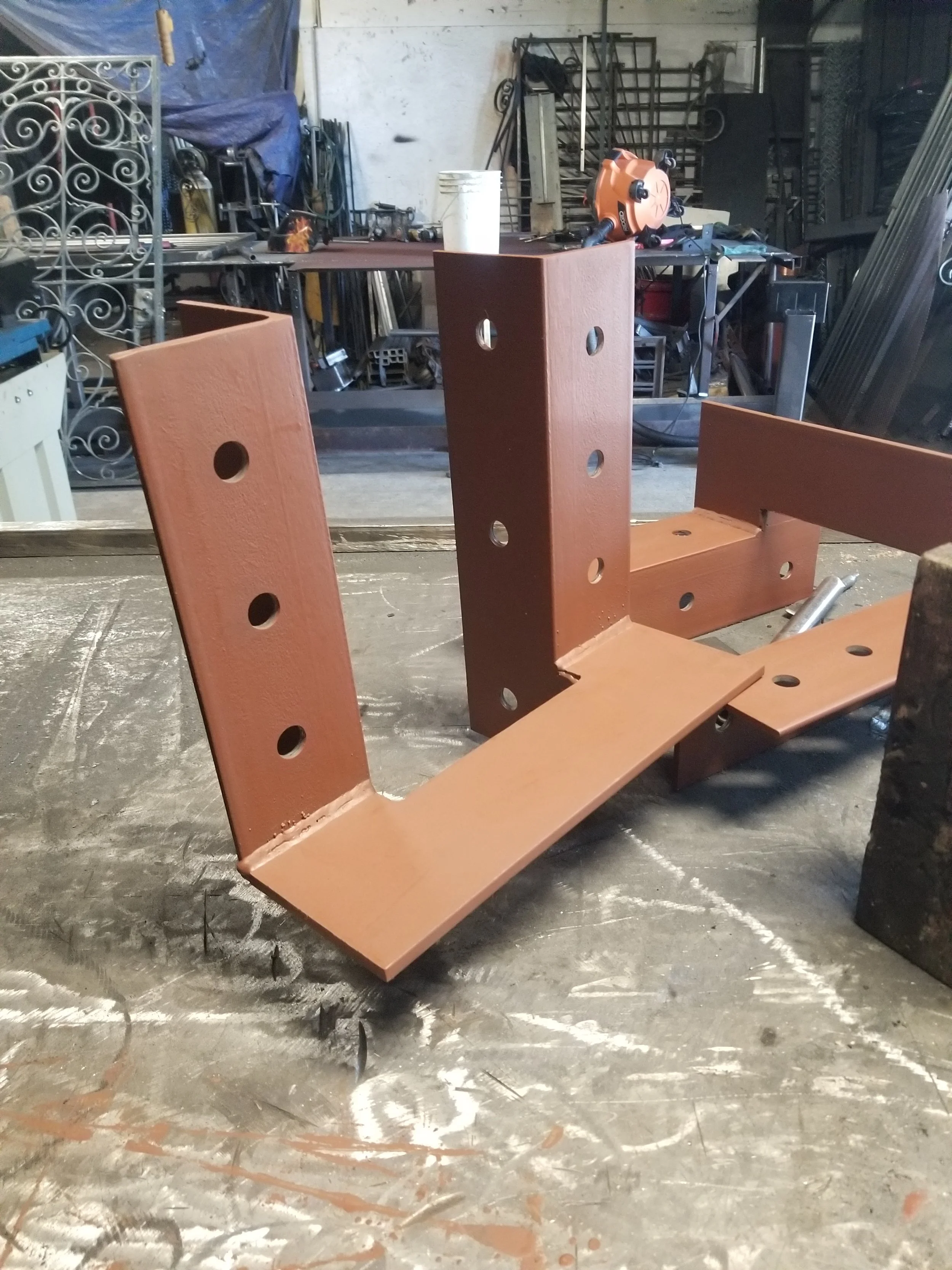 Our warehouse gallery and witness innovation at its finest. A bold red iron square project takes center stage, reflecting the mastery of our top-tier welding team.