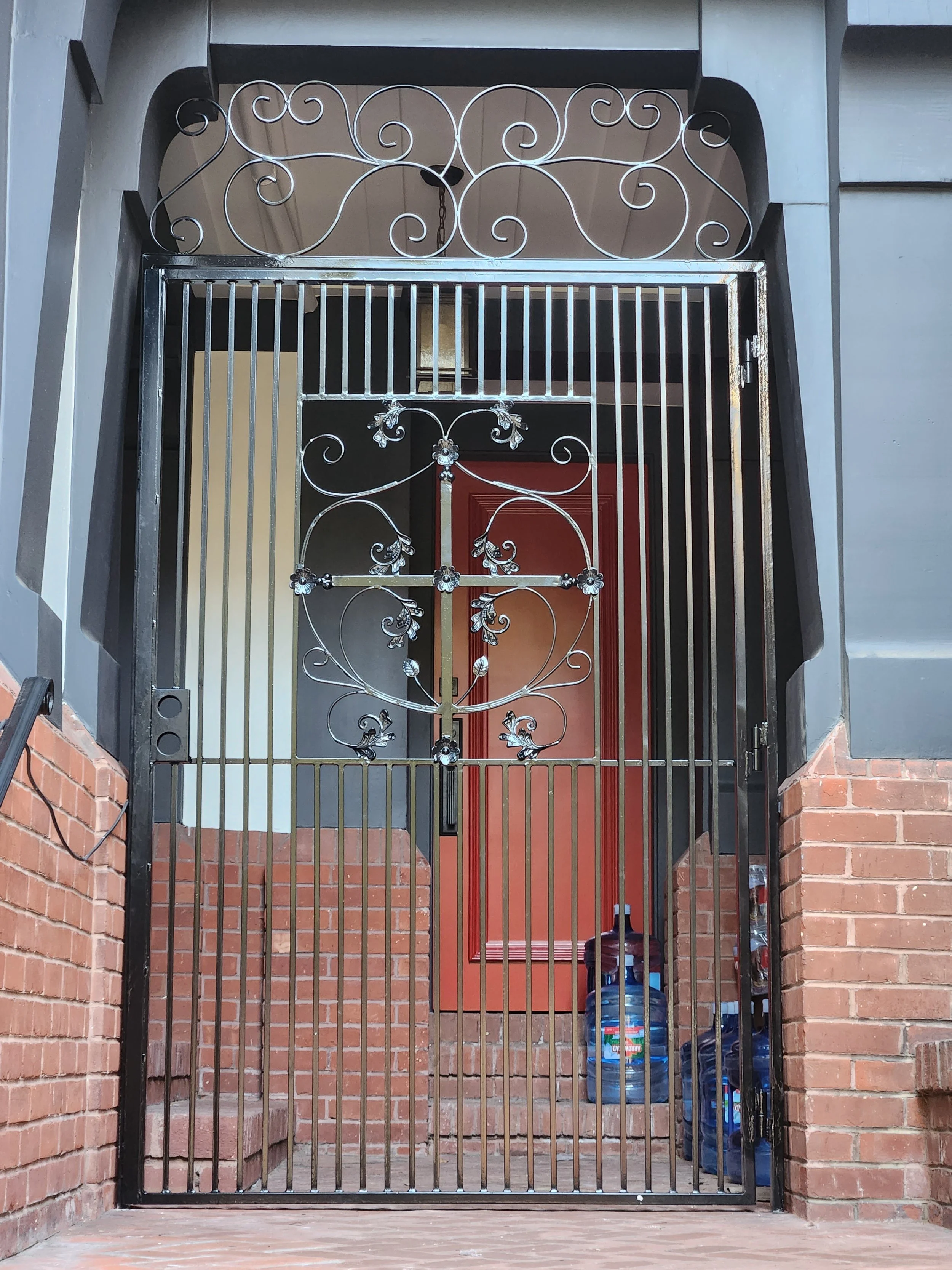 The details of an iron gate and welded by the ironworker make it look elegant and more secure for the main entrance of the home.
