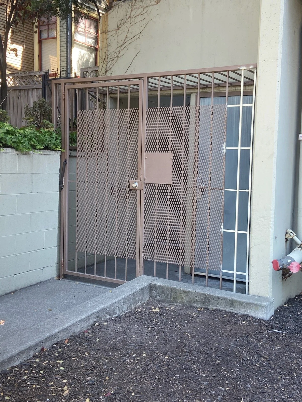 A light brown iron gate for the main door house security, designed and welding by the best iron expert in the area.
