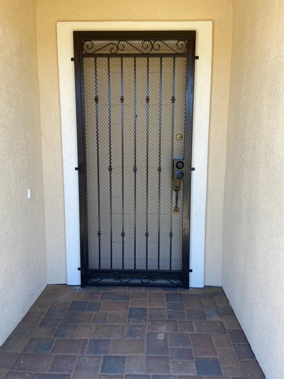 The home security crafted door installation by our expert in iron welding. Every detail is a testament to our commitment to both safety and style, ensuring not only enhanced security but also an elegant aesthetic.