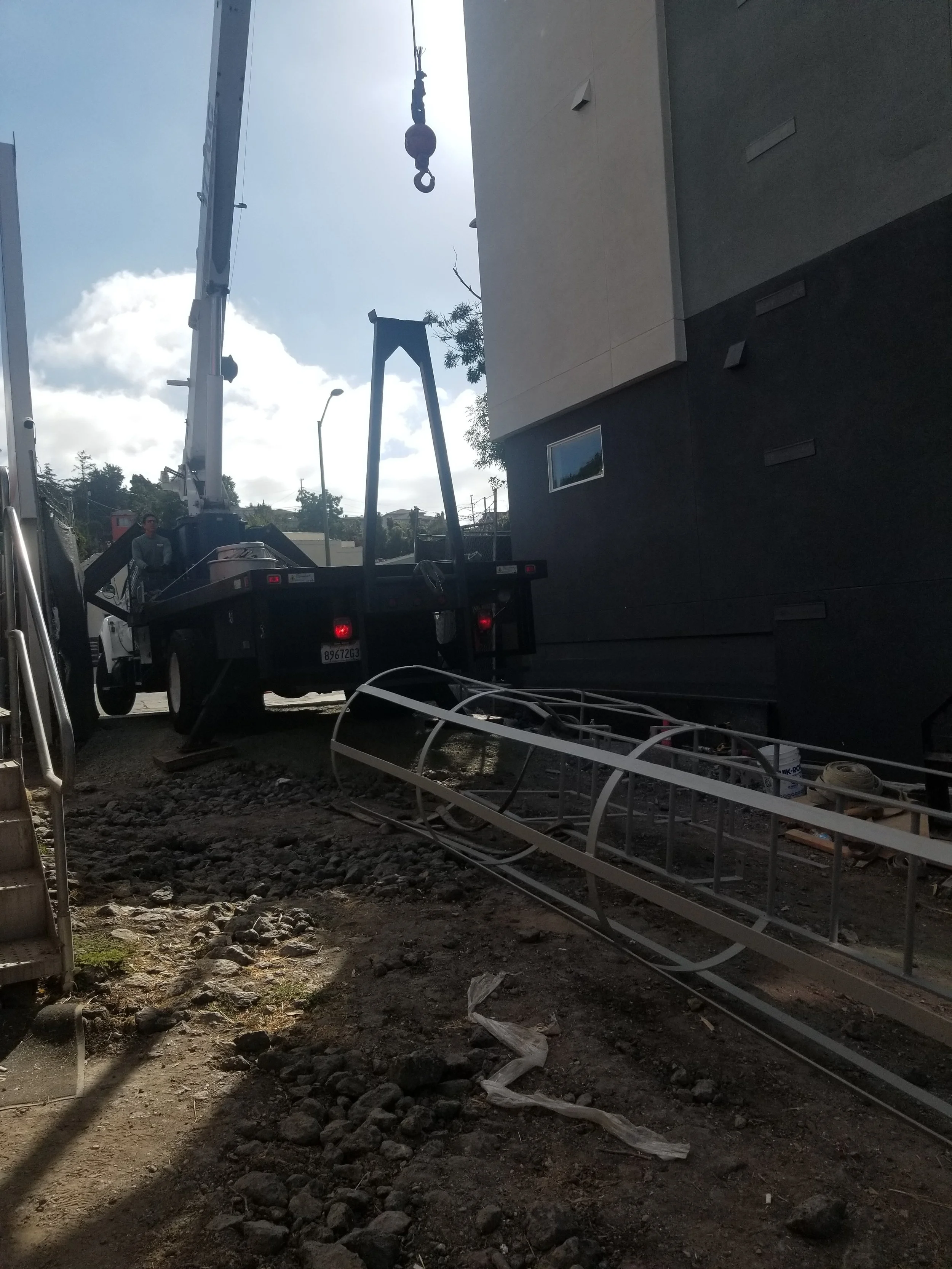 The full-service custom iron works contractor team are making the installation.