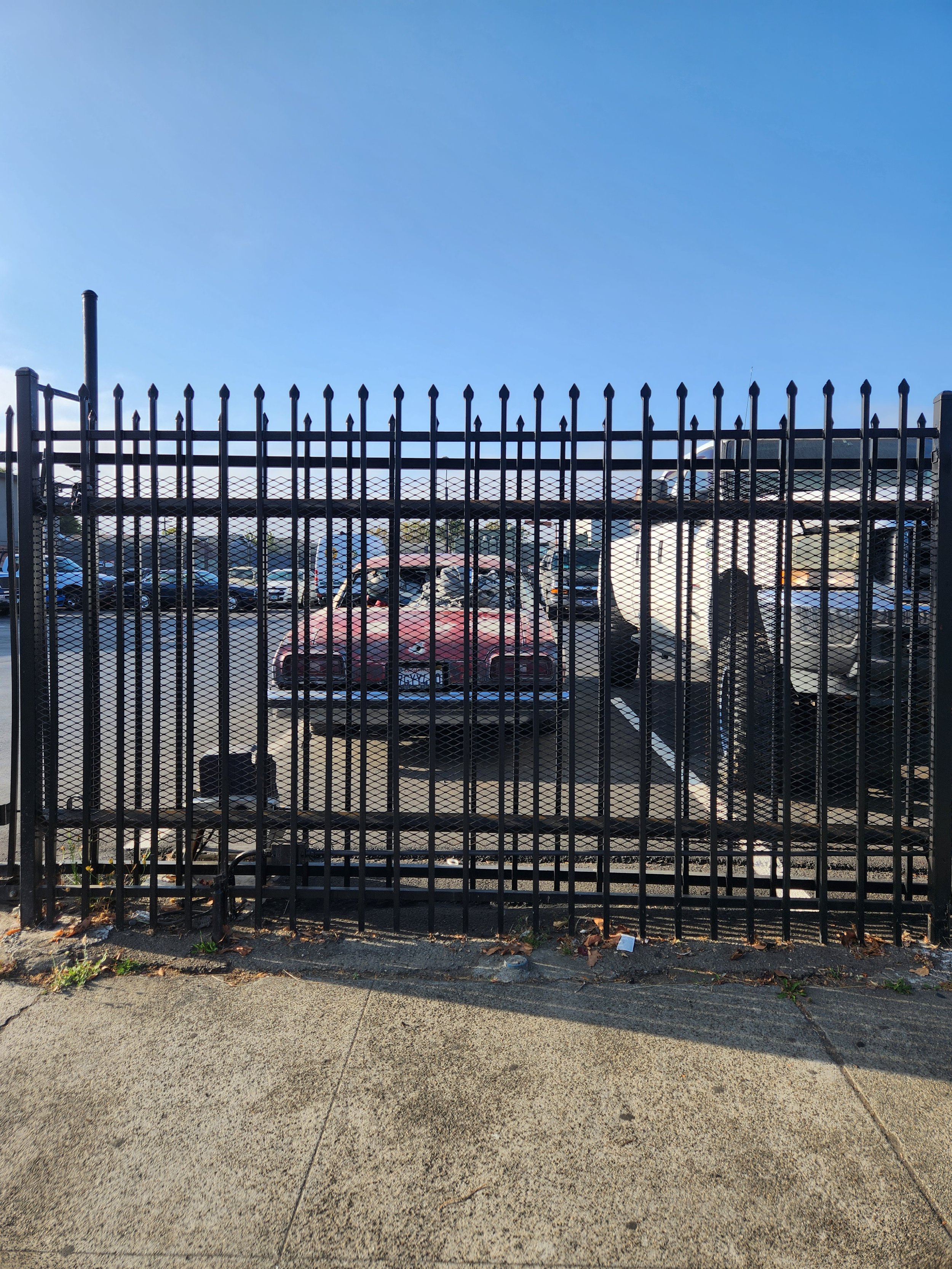 The parking lot is separating with the best iron welding gate in the area. 
