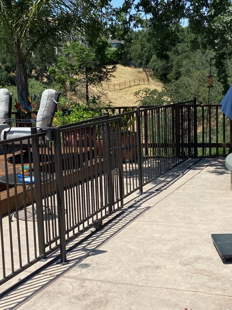 Project for a black fence on an outdoor terrace of a house with a view to nature.