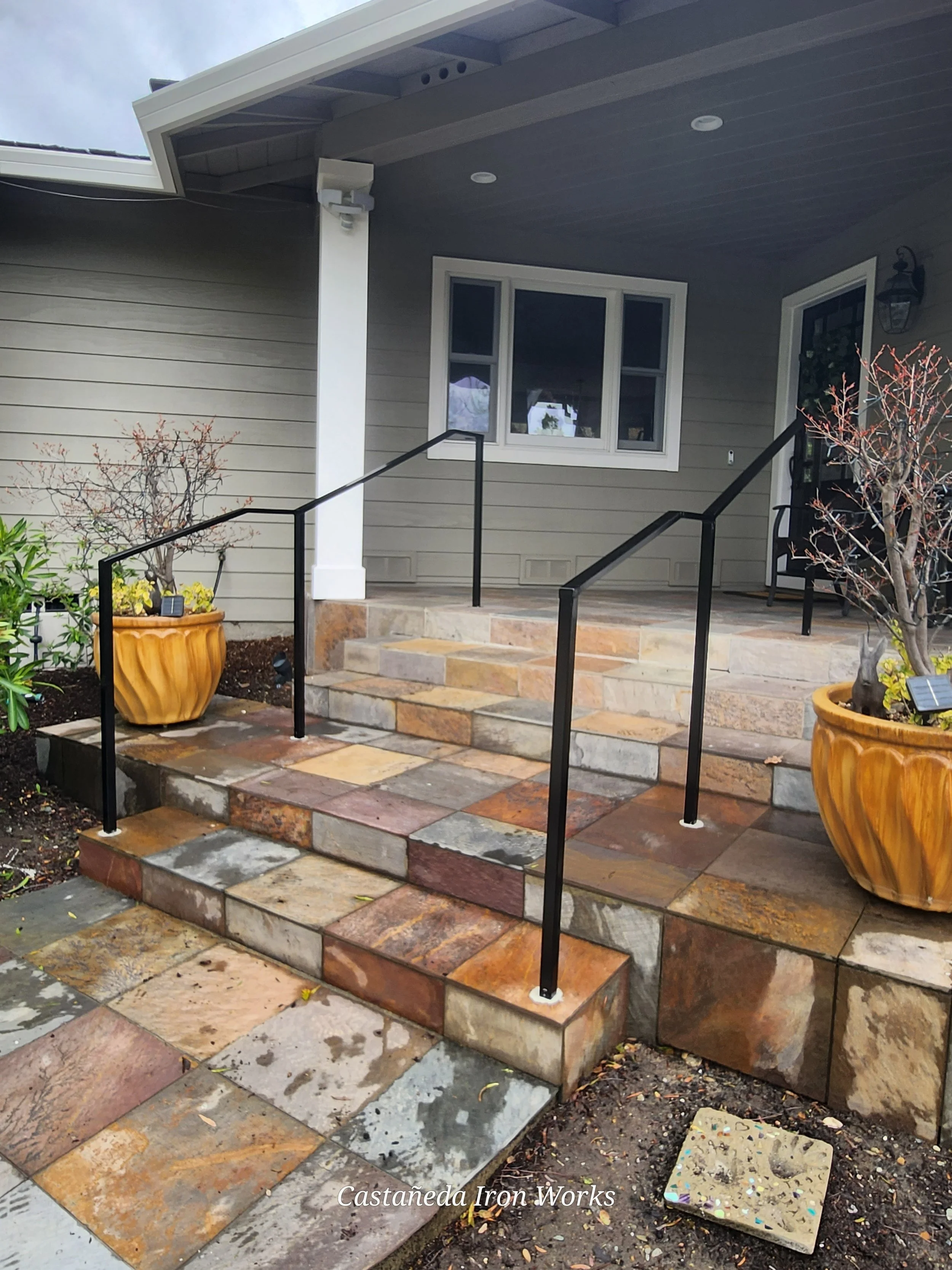 Featuring stunning black handrails crafted by our expert in ironworks. 