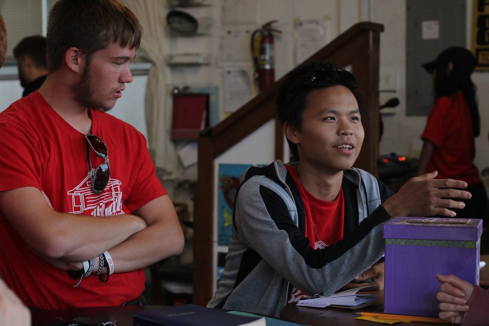 Two volunteers talking to passerby.jpg