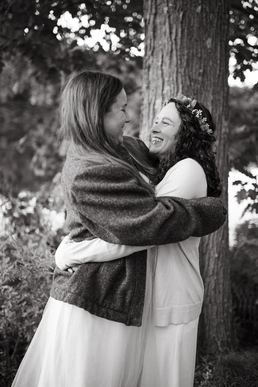LBGT couple smiling and hugging after getting married