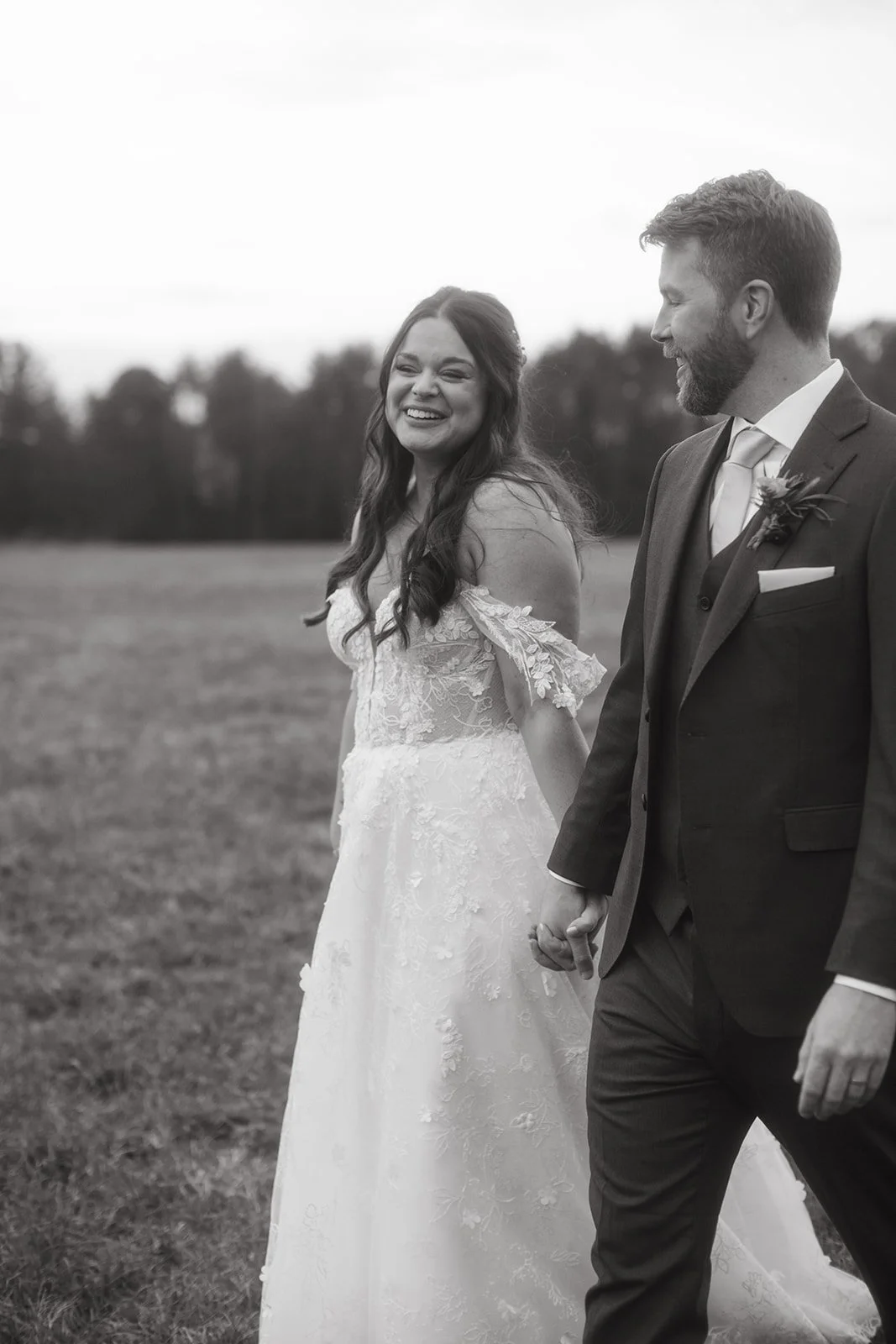 wedding couple take a stroll during portraits at valley view farm in western ma