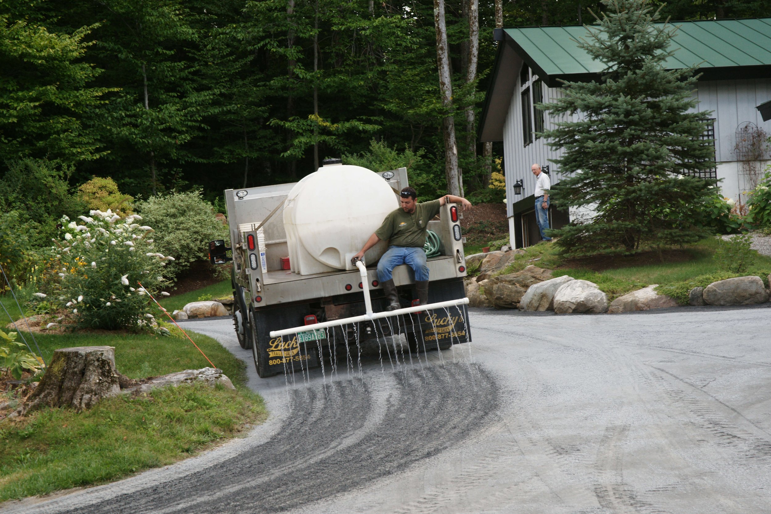 adding water to driveway repair site in vermont