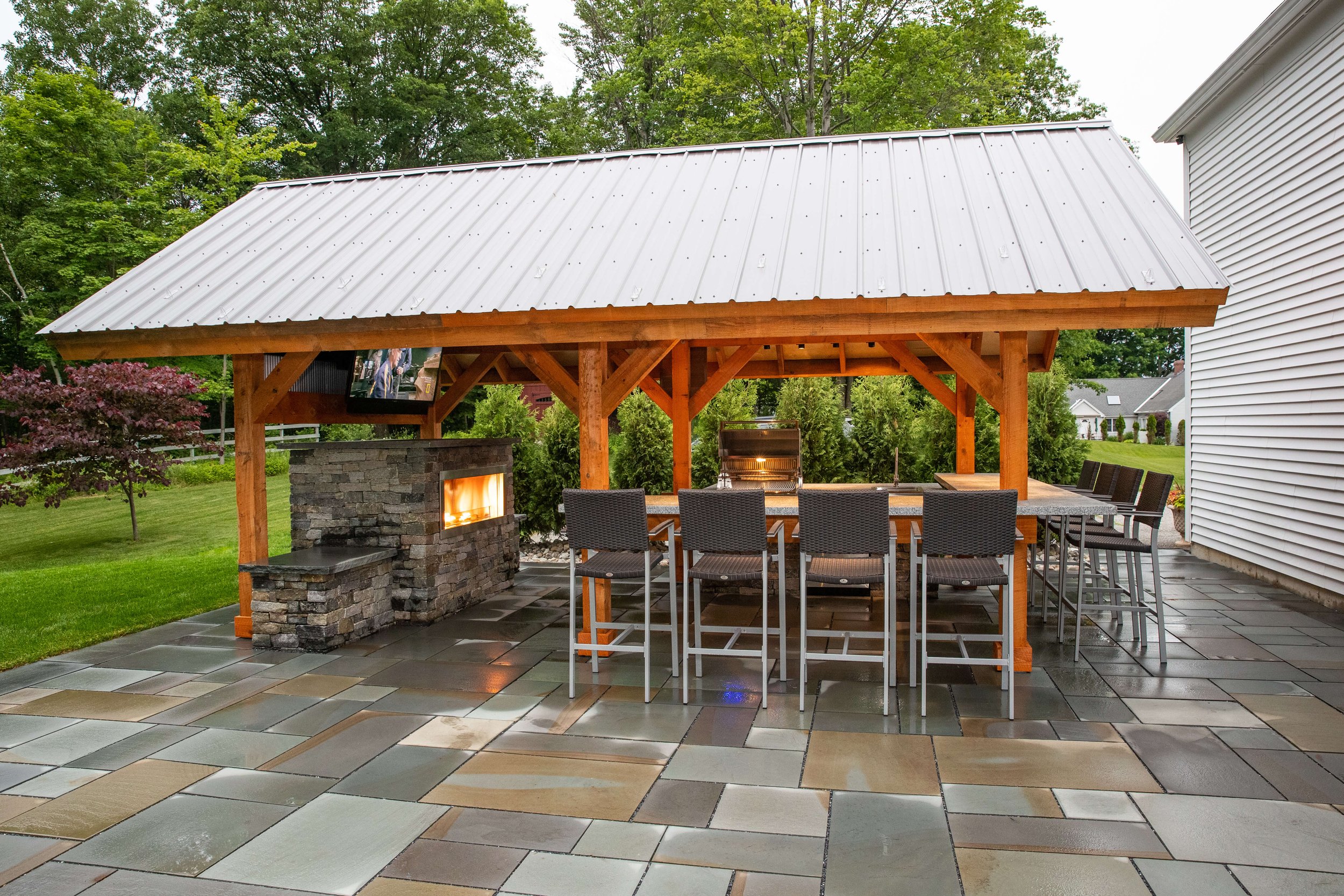 covered outdoor entertainment area by vermont landscaping company