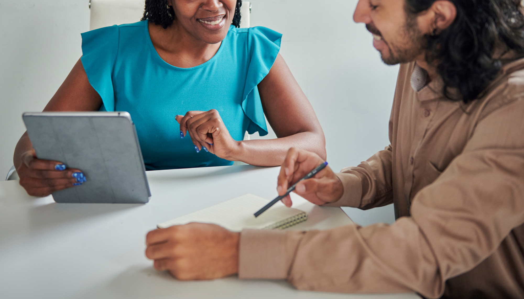 Life coach meeting with a client to discuss goals, personal development, accountability, and next steps during a one-on-one coaching session.