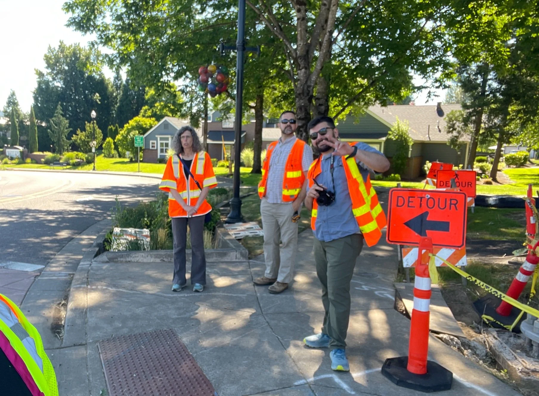 Point North Team wearing construction vests on sidewalk