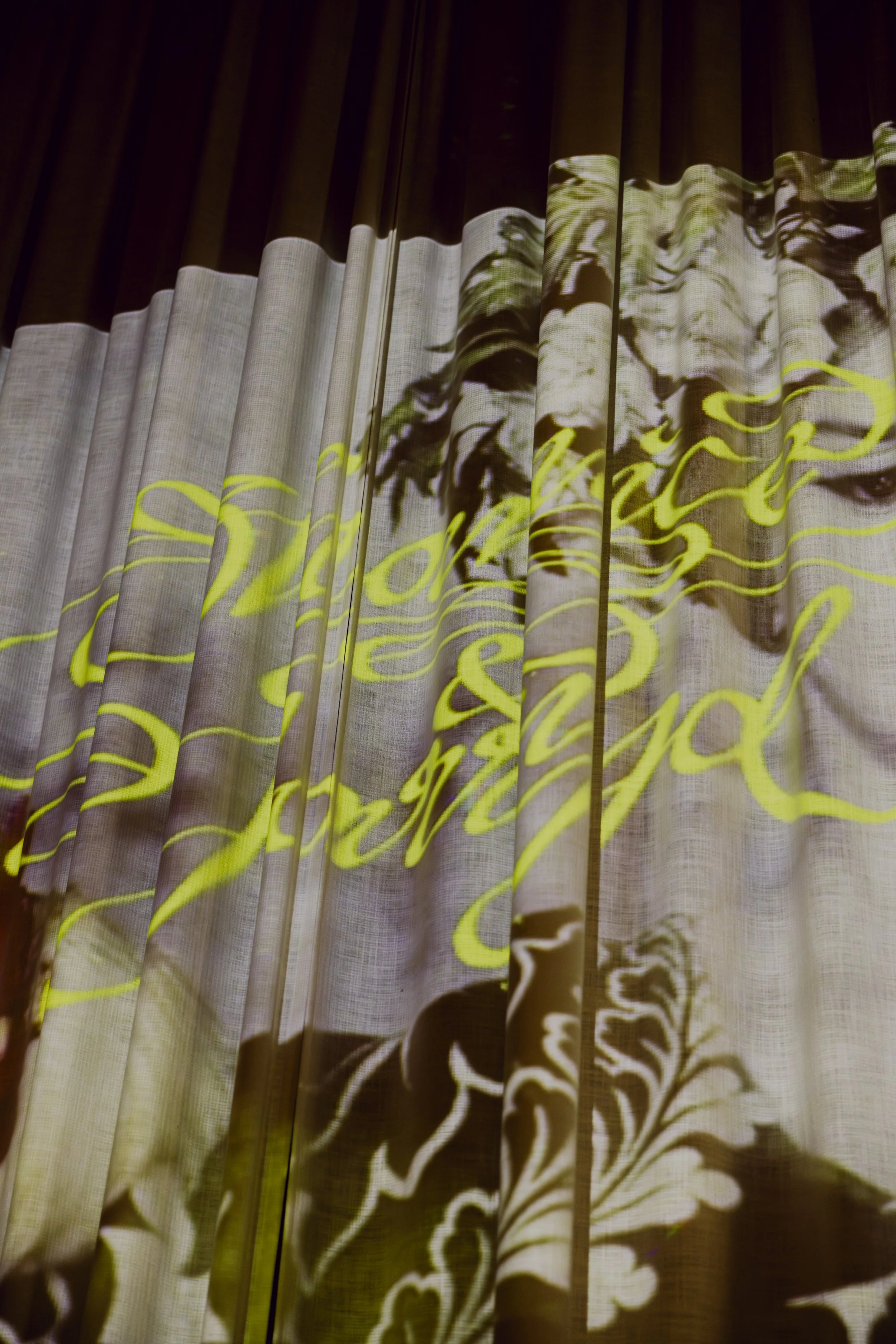 Wedding decal projected onto a curtain