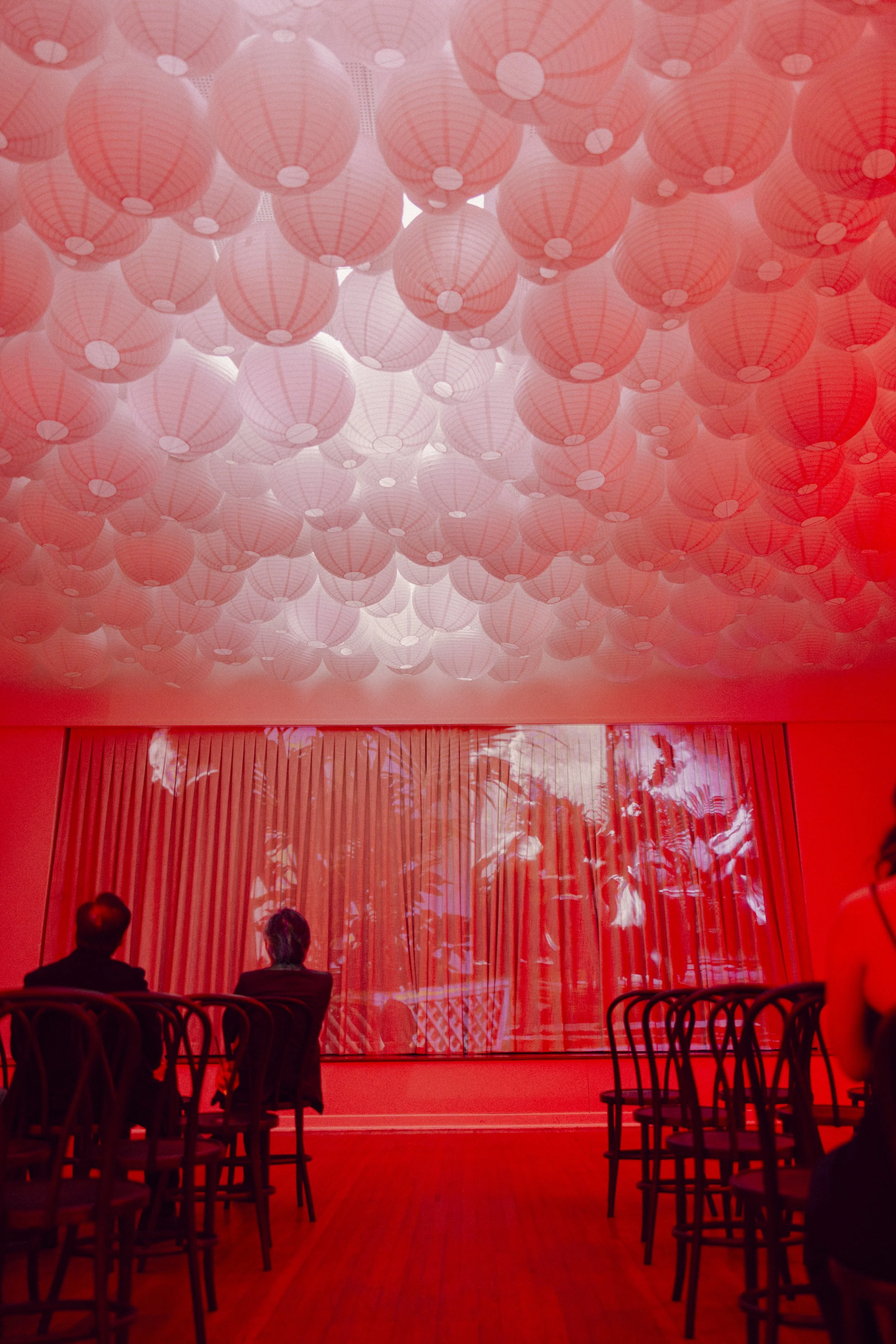 Modern wedding ceremony look with a projection on a curtain 