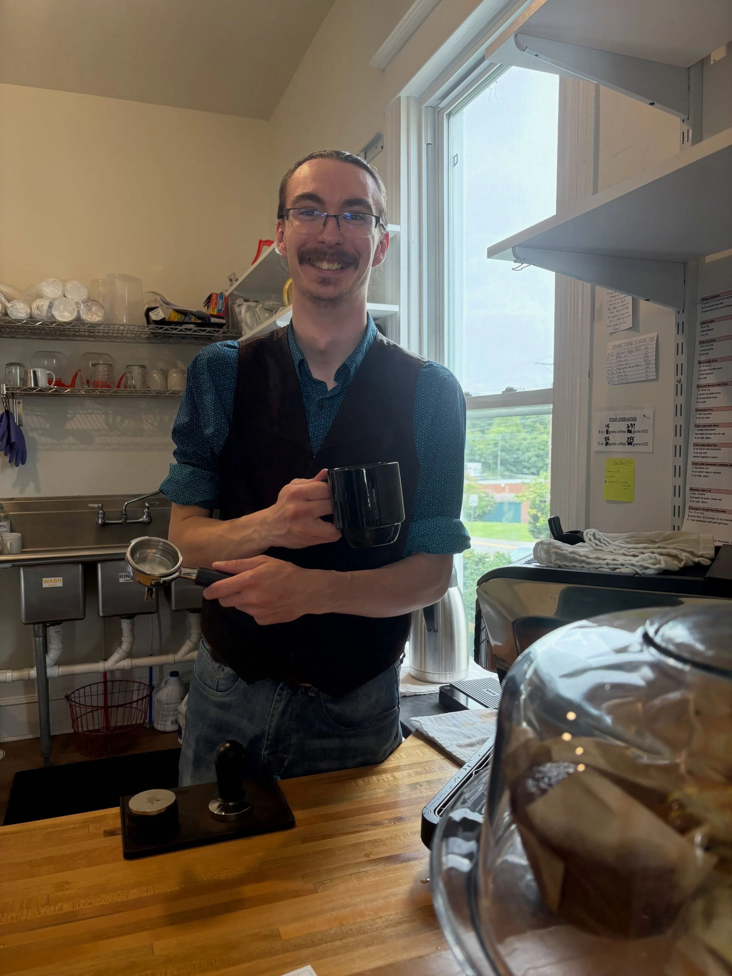Have you met Galen? He is our resident barista and fearless Dungeon Master, and would love to make you a drink and discuss dragons and aesthetics with you!
