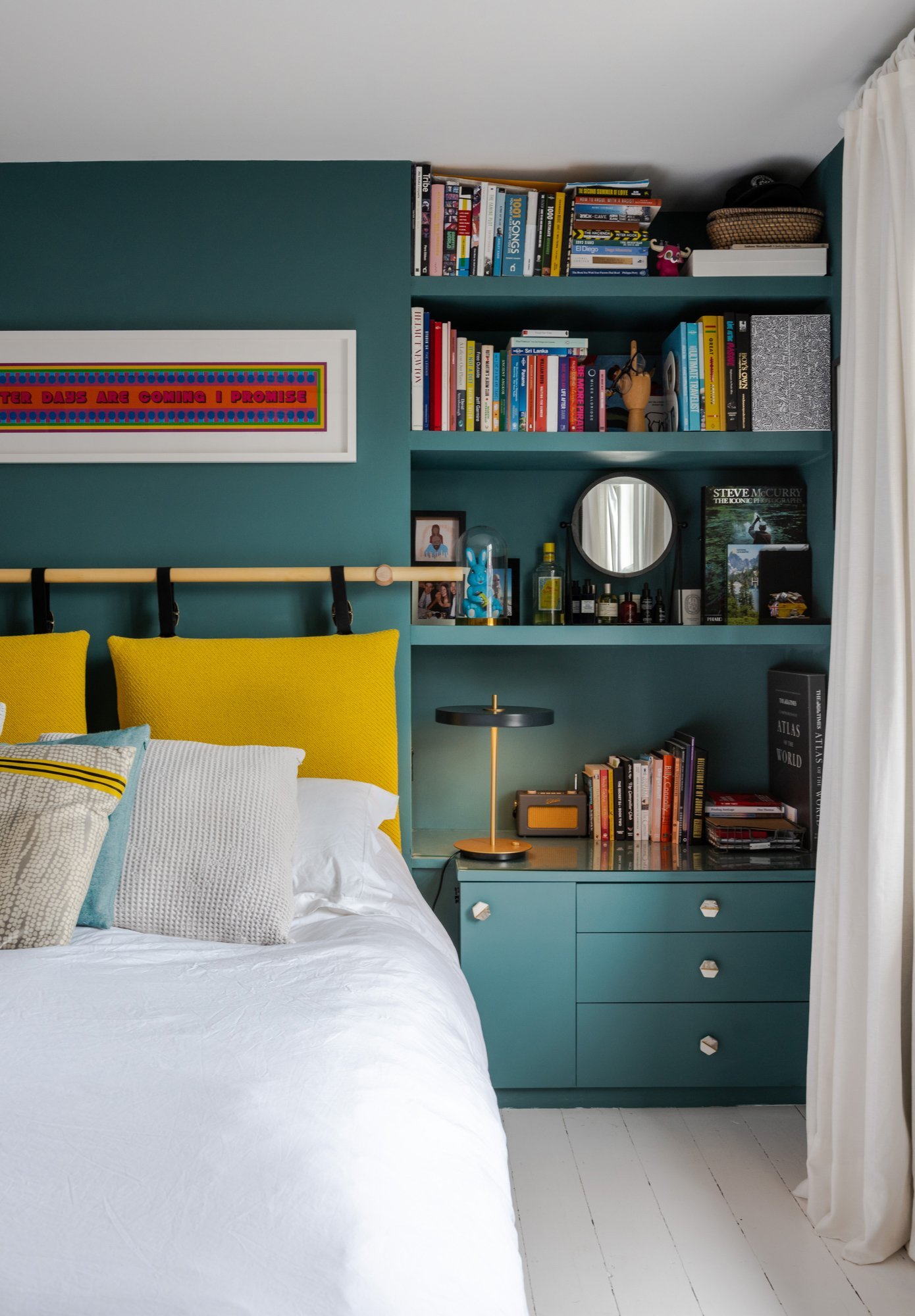 Painting the woodwork and walls all the same colour helps create a restful backdrop for all your knick knacks. Here it also lets the yellow pop.