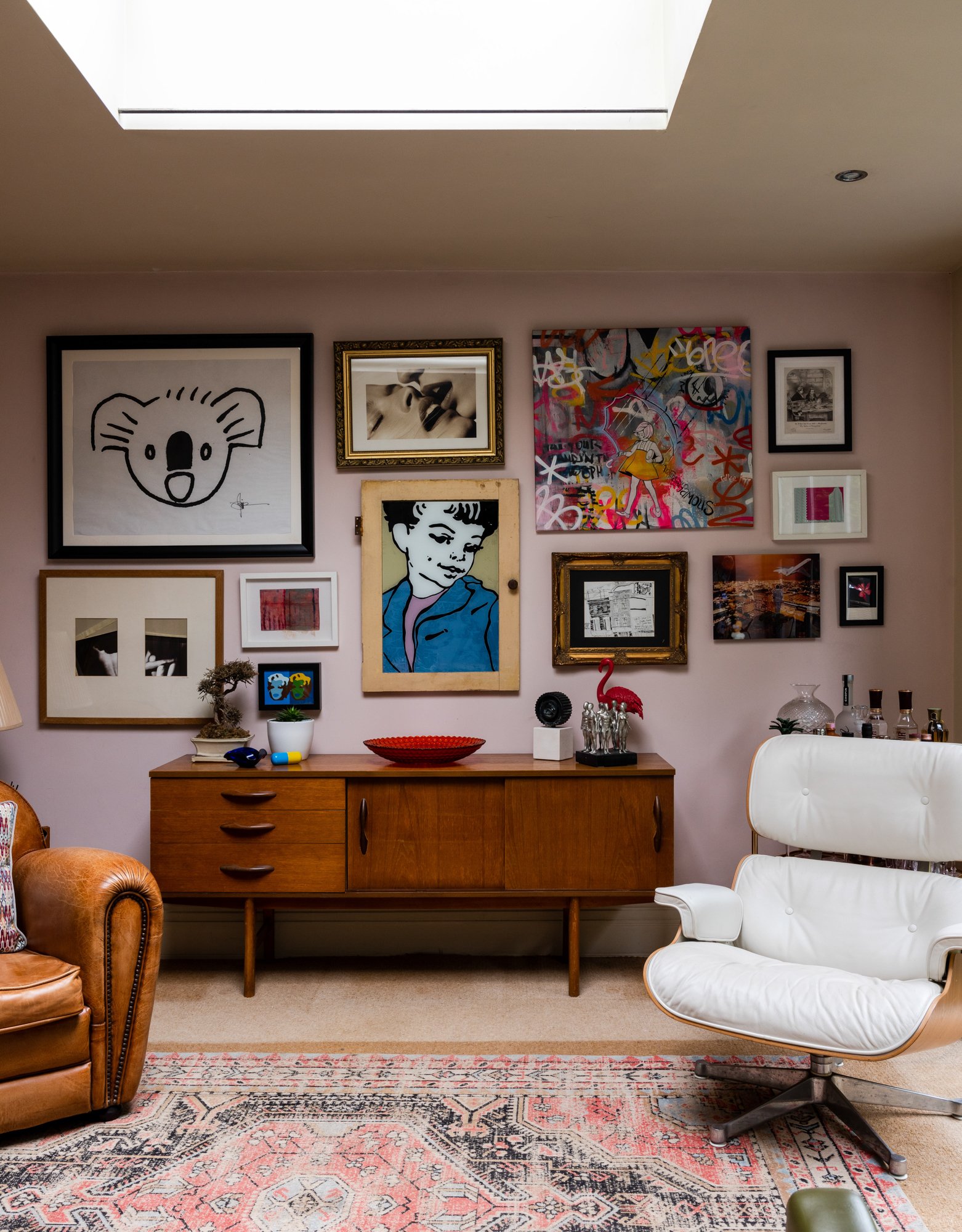 A pink backdrop for a super cool gallery wall