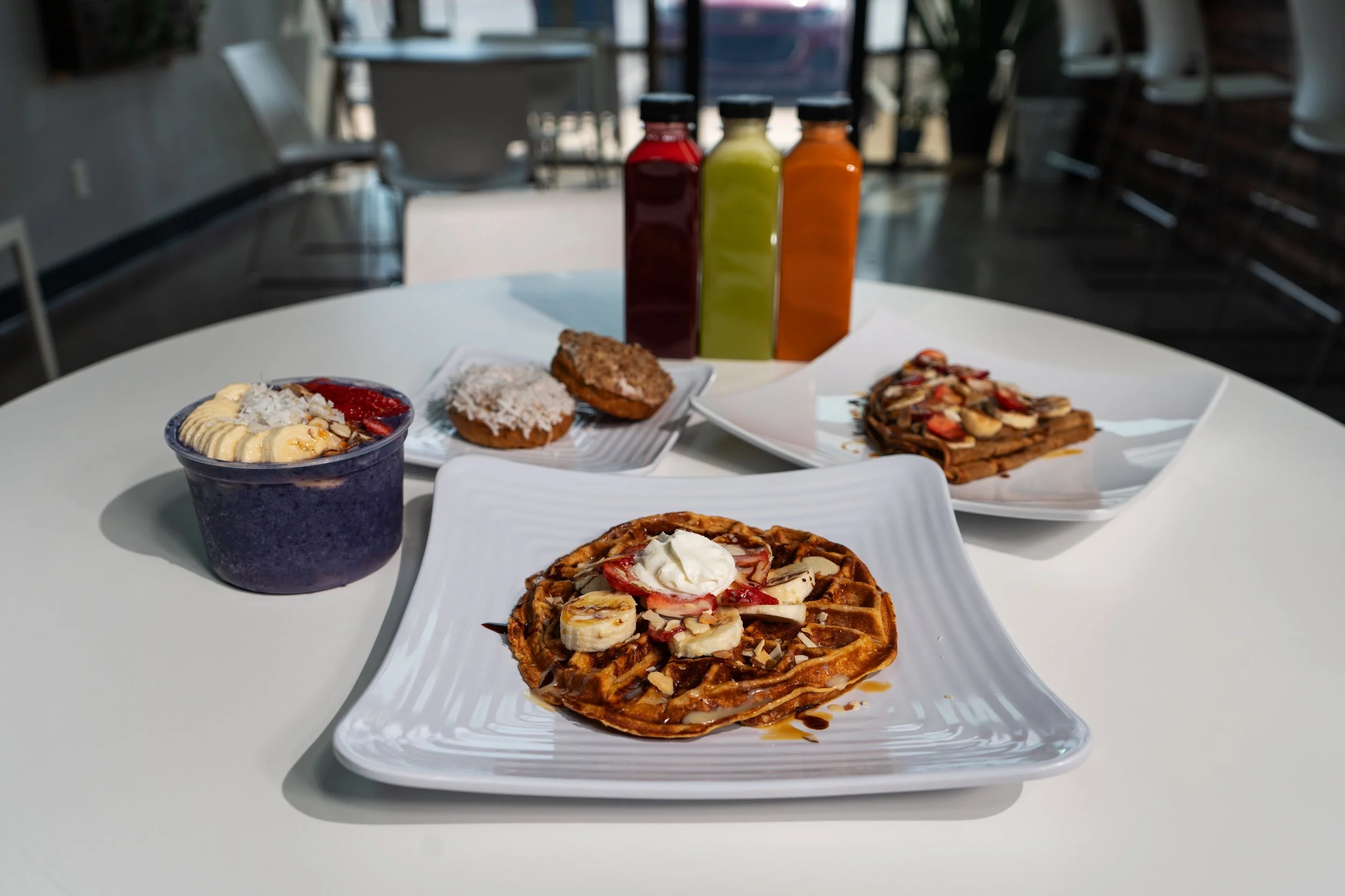 Assorted_waffles_and_smoothies_on_table.jpg